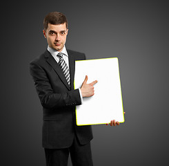 Image showing businessman with empty write board