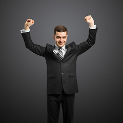 Image showing businessman with hands up