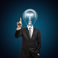 Image showing businessman with lamp-head push the button
