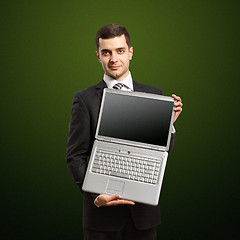 Image showing businessman with open laptop in his hands