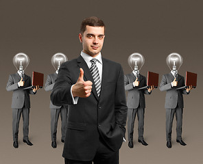 Image showing lamp head business people with laptops