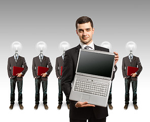 Image showing lamp head businesspeople with laptop