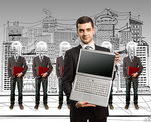 Image showing lamp head businesspeople with laptop