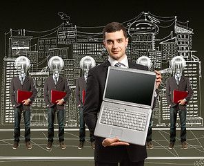Image showing lamp head businesspeople with laptop