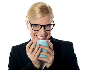 Image showing Corporate woman enjoying coffee