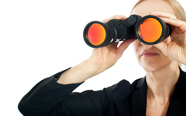 Image showing Businesswoman looking through binoculars