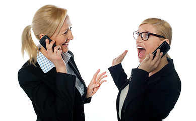 Image showing Happy businesswomen communicating on cellphone