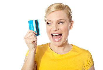 Image showing Smiling young girl holding debit-card