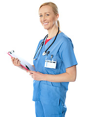 Image showing Experienced female doctor with clipboard