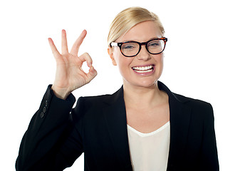 Image showing Successful business woman posing with ok sign