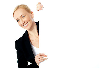 Image showing Portrait of a businesswoman holding clipbaord