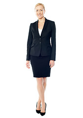 Image showing Gorgeous female executive posing with crossed legs