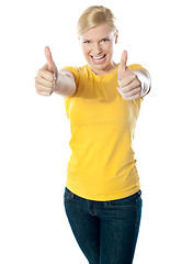 Image showing Happy young woman showing double thumbs-up