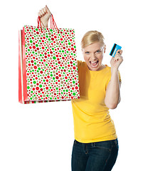 Image showing Shopaholic teenager posing in excitement