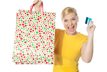 Image showing Beautiful girl posing with shopping paper bag