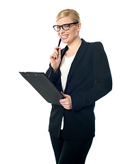 Image showing Smiling mischievous female business executive