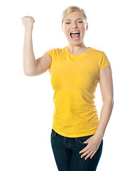 Image showing Fashionable teenager poisng with raised arms