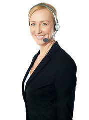 Image showing Aged female call centre excutive posing with headsets