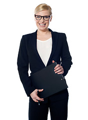 Image showing Attractive femaleholding business documents