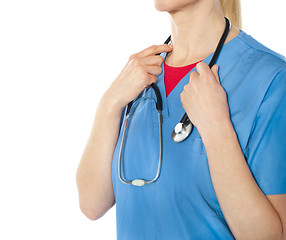 Image showing Female professional doctore holding stethoscope, closeup