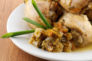 Image showing Roasted chicken legs vegetables saute and greens