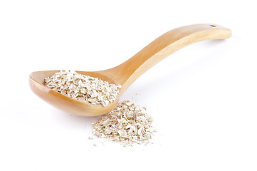 Image showing Oat meal cereal mixed in wooden spoon 