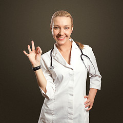 Image showing young doctor woman shows ok