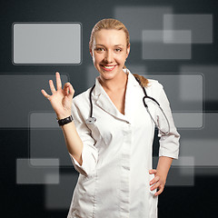 Image showing young doctor woman shows ok