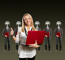 Image showing woman and lamp head businesspeople with laptop