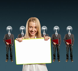 Image showing woman and lamp head businesspeople with laptop