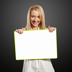 Image showing happy businesswoman holding blank white card