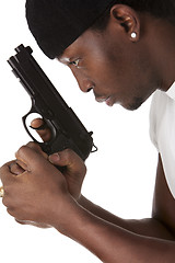 Image showing Young thug with a gun