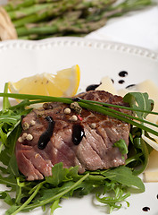 Image showing Beef on arugula salad and parmesan