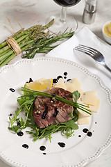 Image showing Beef on arugula salad and parmesan