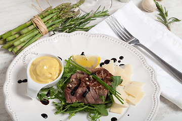 Image showing Beef on arugula salad and parmesan