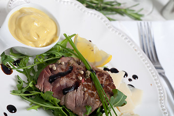 Image showing Beef on arugula salad and parmesan