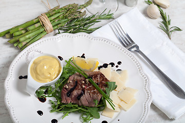 Image showing Beef on arugula salad and parmesan