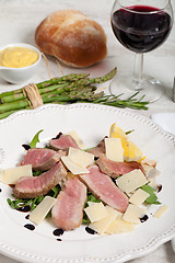 Image showing Beef on arugula salad and parmesan