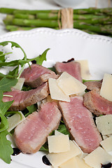 Image showing Beef on arugula salad and parmesan