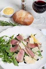 Image showing Beef on arugula salad and parmesan