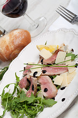 Image showing Beef on arugula salad and parmesan