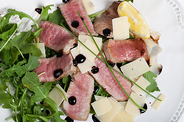 Image showing Beef on arugula salad and parmesan