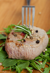 Image showing Cooked piece of beef on arugula salad