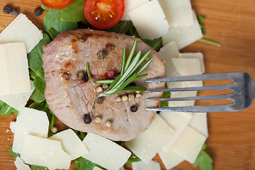 Image showing Cooked Beef on arugula and parmesan