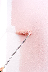 Image showing painting a wall in pink