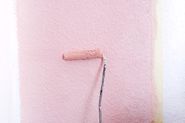 Image showing painting a wall in pink