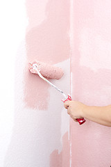 Image showing painting a wall in pink