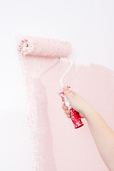 Image showing painting a wall in pink