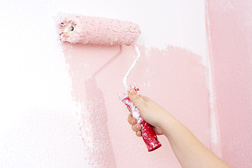 Image showing painting a wall in pink