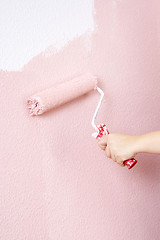 Image showing painting a wall in pink